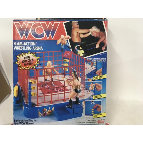 1077 - Two boxed games including WCW Slam Action Wrestling Arena. Also HeroQuest board game by MB games.