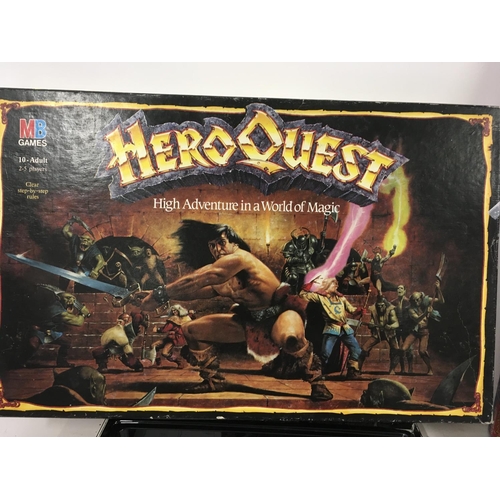 1077 - Two boxed games including WCW Slam Action Wrestling Arena. Also HeroQuest board game by MB games.