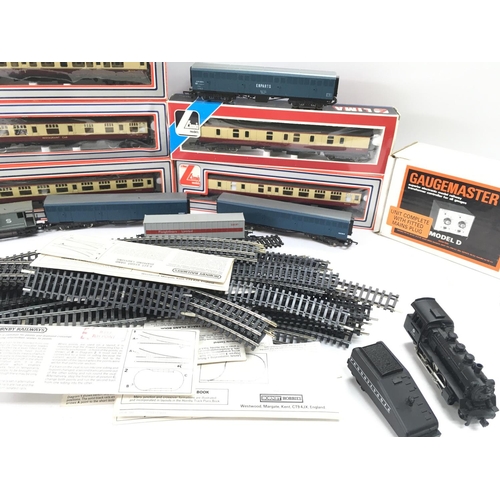 128 - A Box Containing a Collection of Llima 00 Gauge Coaches Track and a Gaugemaster Transformer.