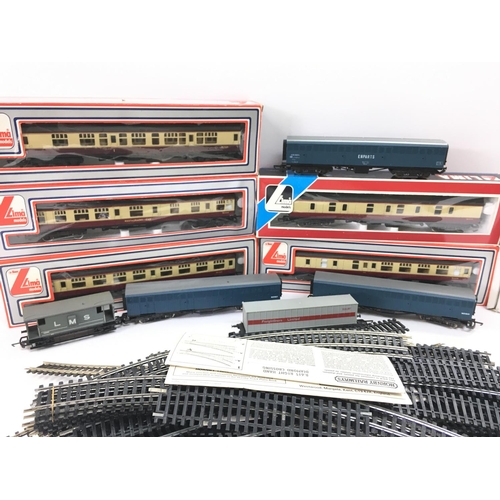 128 - A Box Containing a Collection of Llima 00 Gauge Coaches Track and a Gaugemaster Transformer.