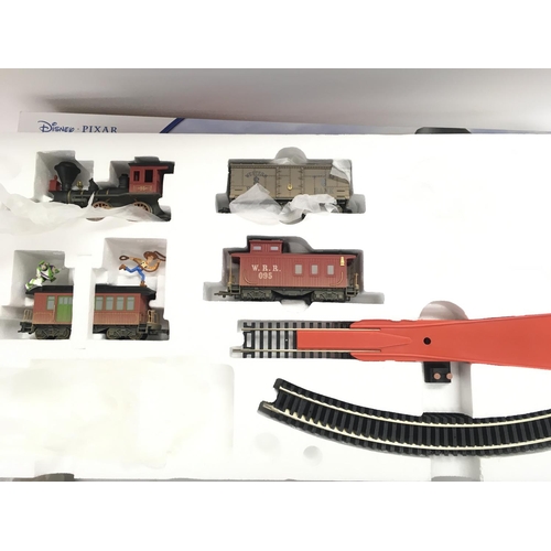 135 - A Boxed Hornby 00 Gauge Toy Story 3 Electric Train Set #R1149. Controller and plug missing.