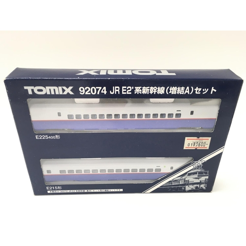 143 - A Boxed Tomix N Gauge 92073 Bullet Train Series E2. And a set Of Carrigies.