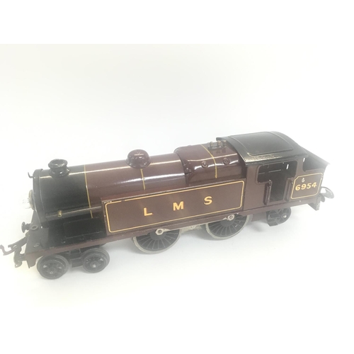 173 - A Hornby 0 Gauge Electric LMS Locomotive.a Collection of tin 0 Gauge Buildings and Rolling Stock.