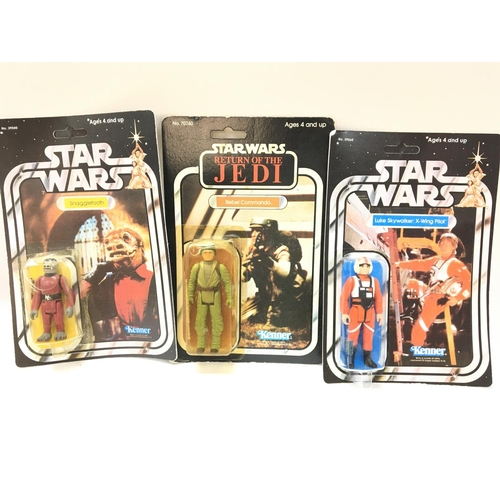 19 - A Box Containing Vintage Star Wars ships. 2 reproduction carded Figures and a Carded Rebel Commando.