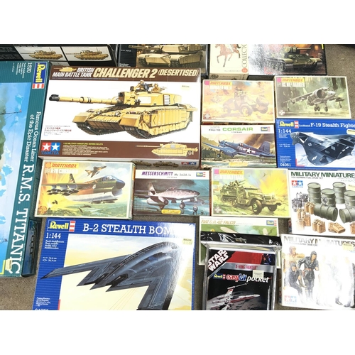 192 - A Box Containing a Collection of Various Model Kits Including Tanks. Aircraft. And A Titanic.