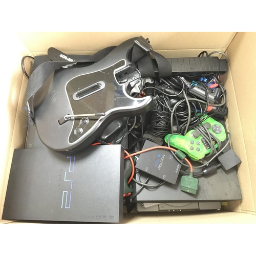 22 - A Box Containing A Collection of PlayStation consoles and Controllers.