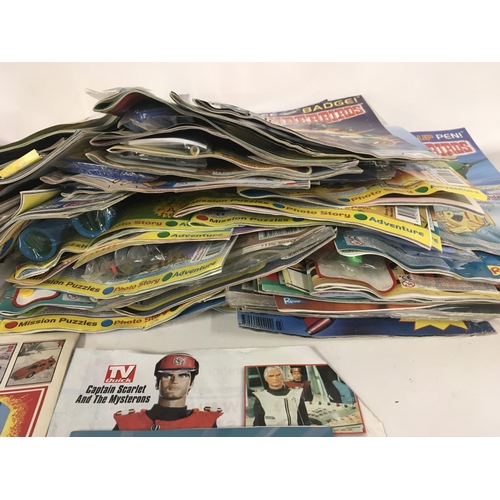 31 - A collection of thunderbirds and Captain scarlet toys. Also Thunderbirds magazine comics the majorit... 