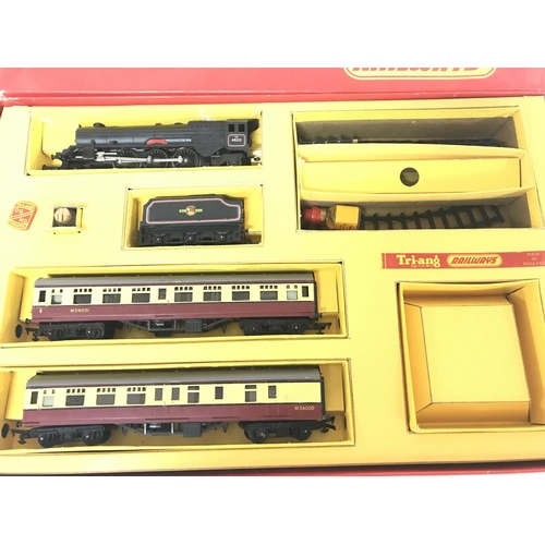 338 - A Boxed Tri-Ang Train Set #R3A a Box of Track a Level Crossing etc.