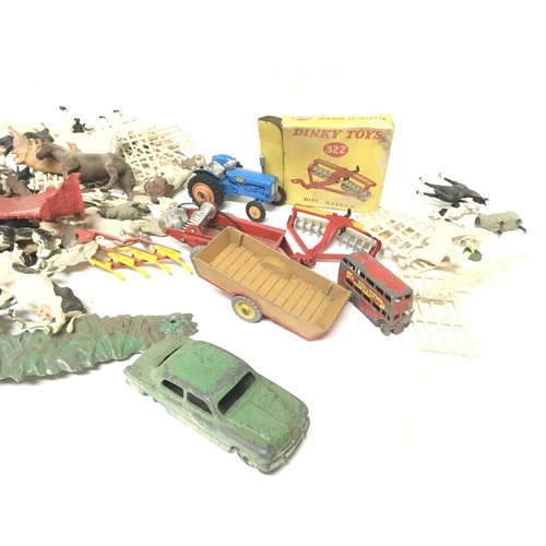 341 - A Collection Of Britains Farm Animals. A Collection of Playworn Dinky and a Boxed Disc Harrow #322.