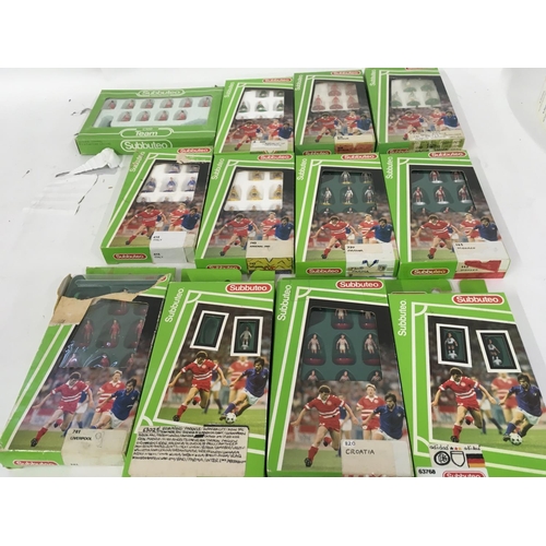 35 - A collection of 12 boxed Subbuteo football teams