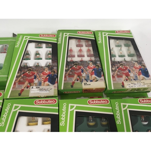 35 - A collection of 12 boxed Subbuteo football teams