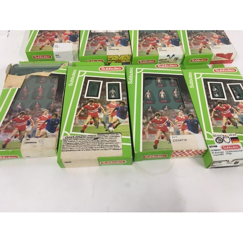 35 - A collection of 12 boxed Subbuteo football teams