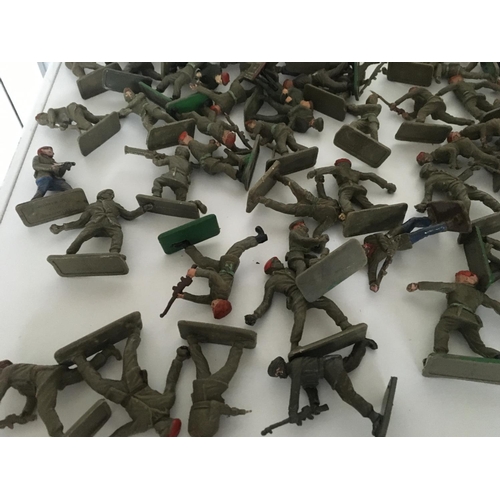 373 - A collection of approximately 100 plastic toy paratrooper soldiers by Crescent.