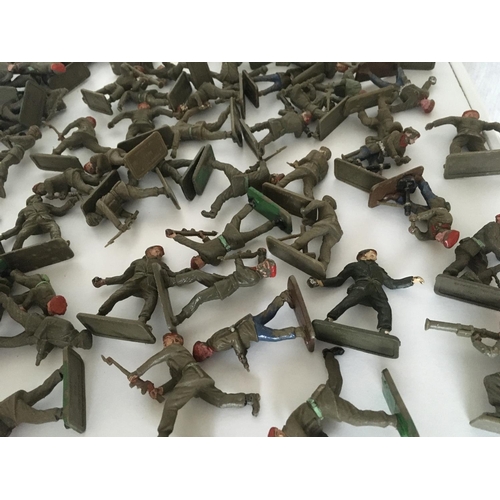 373 - A collection of approximately 100 plastic toy paratrooper soldiers by Crescent.