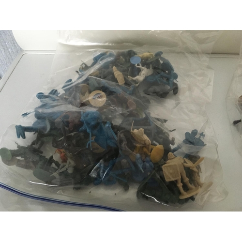 375 - A collection of 19 plastic mounted cowboys and Indians by Herald and Britains. Also includes 4 bags ... 