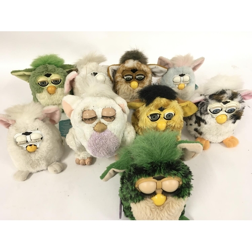 38 - A collection of 9 Furbys.