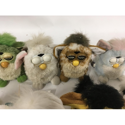 38 - A collection of 9 Furbys.