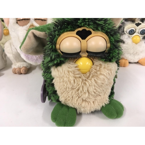 38 - A collection of 9 Furbys.