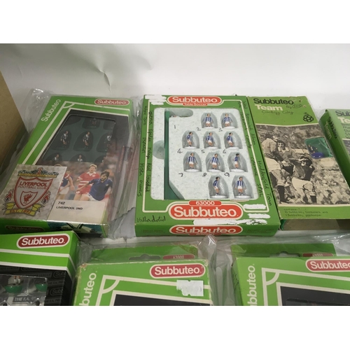 39 - A collection of 10 boxed Subbuteo football teams