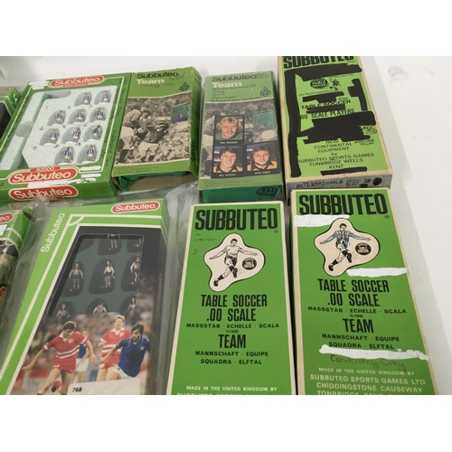 39 - A collection of 10 boxed Subbuteo football teams