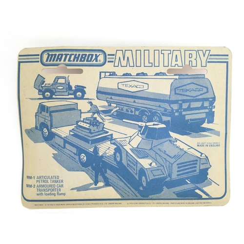 413 - A Carded And Sealed Matchbox MM-2 Armoured Car Transporter With Loading Ramp.