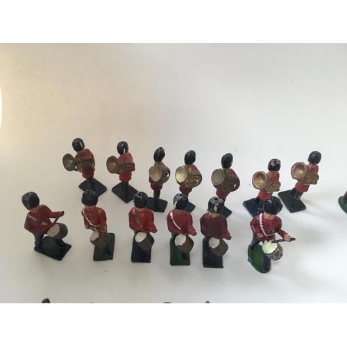 468 - A collection of 35 metal soldiers by Benbros and Crescent comprising a Band.