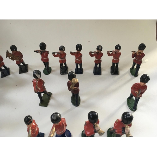 468 - A collection of 35 metal soldiers by Benbros and Crescent comprising a Band.