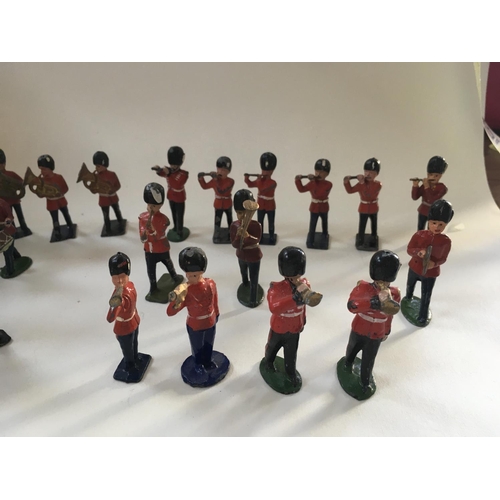 468 - A collection of 35 metal soldiers by Benbros and Crescent comprising a Band.