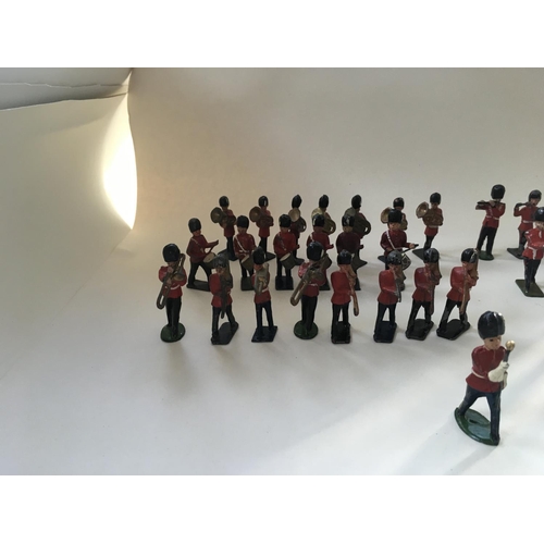 468 - A collection of 35 metal soldiers by Benbros and Crescent comprising a Band.