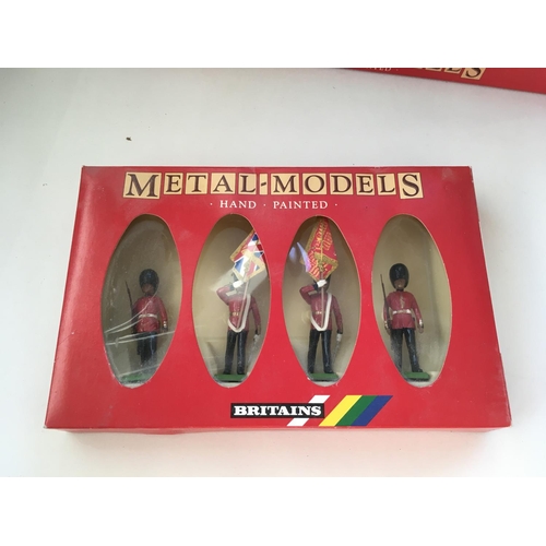 485 - Collection of 4 boxed Britains metal model soldiers