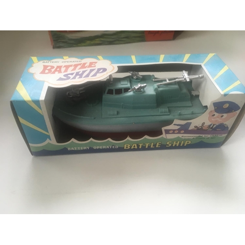 504 - Collection of four boxed toys in the original packaging. Comprising tin plate model tank with workin... 