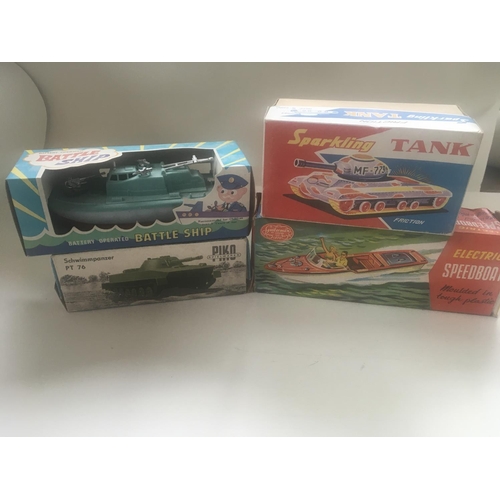 504 - Collection of four boxed toys in the original packaging. Comprising tin plate model tank with workin... 