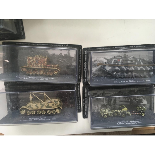 506 - A collection of boxed military vehicles from WW11. Each with the original packaging is mounted in a ... 