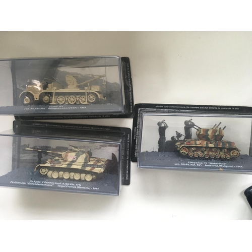 506 - A collection of boxed military vehicles from WW11. Each with the original packaging is mounted in a ... 