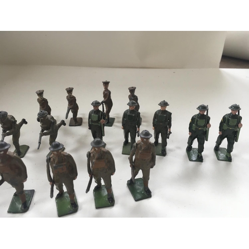 509 - A collection of 23 metal toy soldiers by Britains an another. 19 have moving arm and they are mainly... 