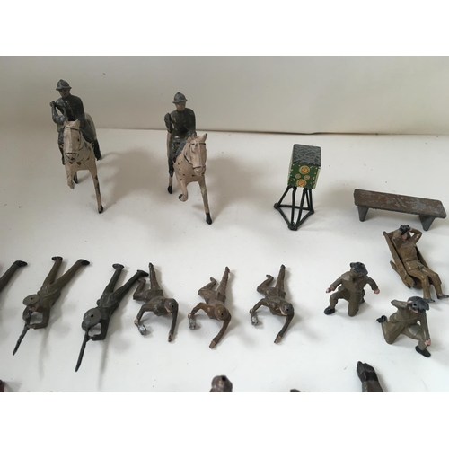 510 - A collection of metal soldiers in various poses in excess of 30 pieces. Manufacturer unclear.