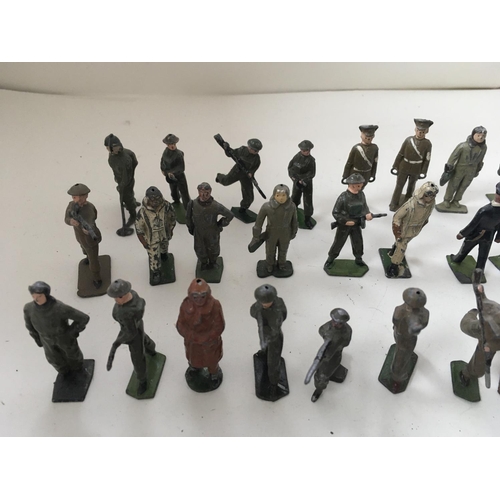 512 - A collection of 50 metal soldiers mainly by Britains in a variety of poses.