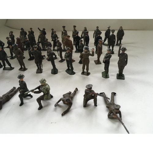 512 - A collection of 50 metal soldiers mainly by Britains in a variety of poses.