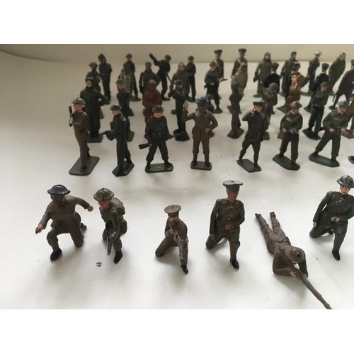 512 - A collection of 50 metal soldiers mainly by Britains in a variety of poses.