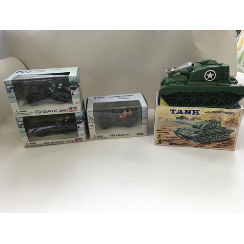 515 - A collection of four boxed toy vehicles comprising 3 jeeps by GATE 2x beetle Bailey and 1 Laurel and... 