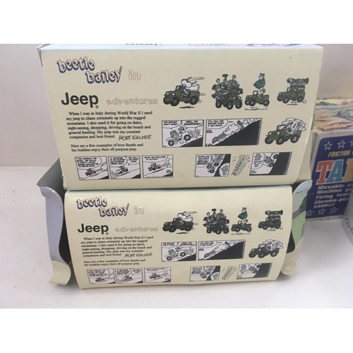 515 - A collection of four boxed toy vehicles comprising 3 jeeps by GATE 2x beetle Bailey and 1 Laurel and... 