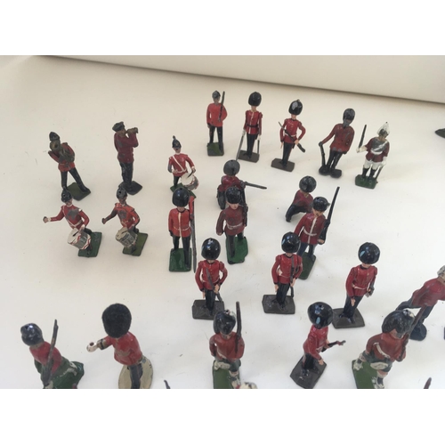 519 - A collection of 37 lead figures mainly by Britains. Themed as British soldiers including musicians a... 