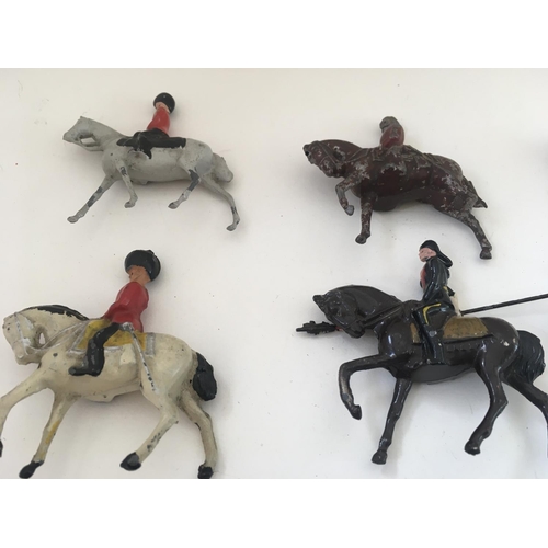 520 - A collection of 14 lead figures by Britains and others. Theme of mounted soldiers