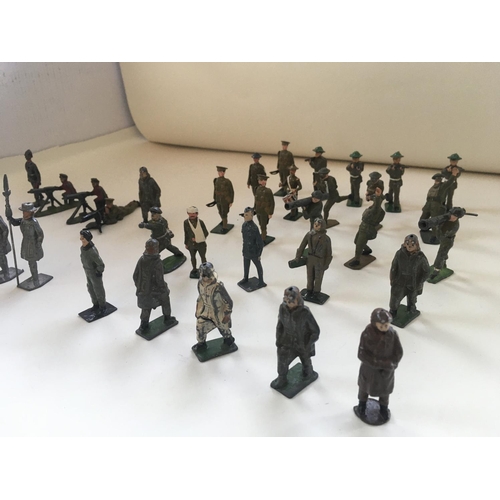 521 - A collection of 36 lead figures mainly Britains themes of military soldiers..airman..machine gunners... 