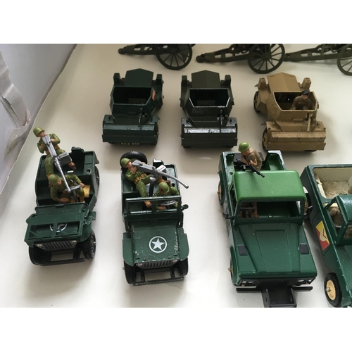 524 - A collection of 24 Playworn diecast model military vehicles by Britains and others.