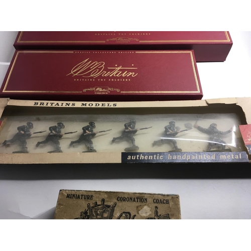 536 - A collection of four boxed metal figures by Britains consisting 00131. 8961. 1613. 1503