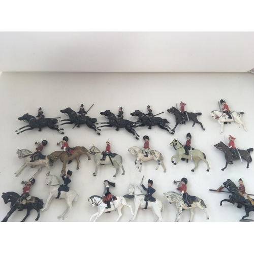 538 - A collection of 30 metal mounted soldiers from differing regiments. Manufactured mainly by Britains.... 