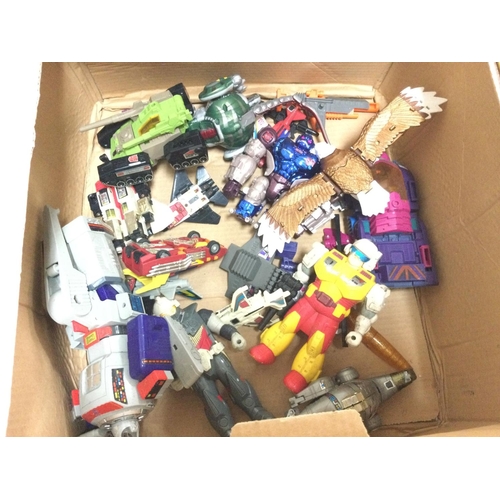 563 - A Box Containing a Collection of Transformer Type Toys. All Playworn.