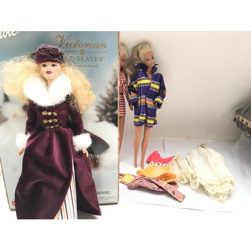 615 - 3 Barbies. One boxed. A Victorian ice Skater.