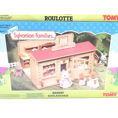 618 - 2 Boxed Sylvanian Families Playsets. A Caravan Roulotte and a Bakery Boulangerie.